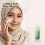 Bangladeshi hijabi model with cleansing foam on cheek beside Anua Heartleaf Quercetinol pore deep cleansing foam tube